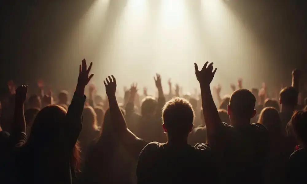 Hands lifted in worship bathed in pure white light; darkness recoils.